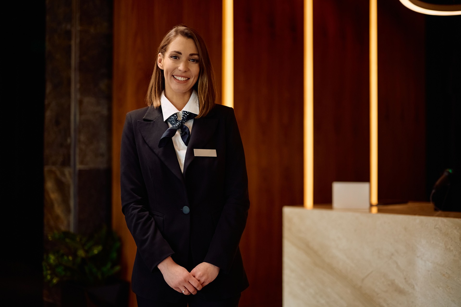 Portrait of female hotel manager looking at camera.
